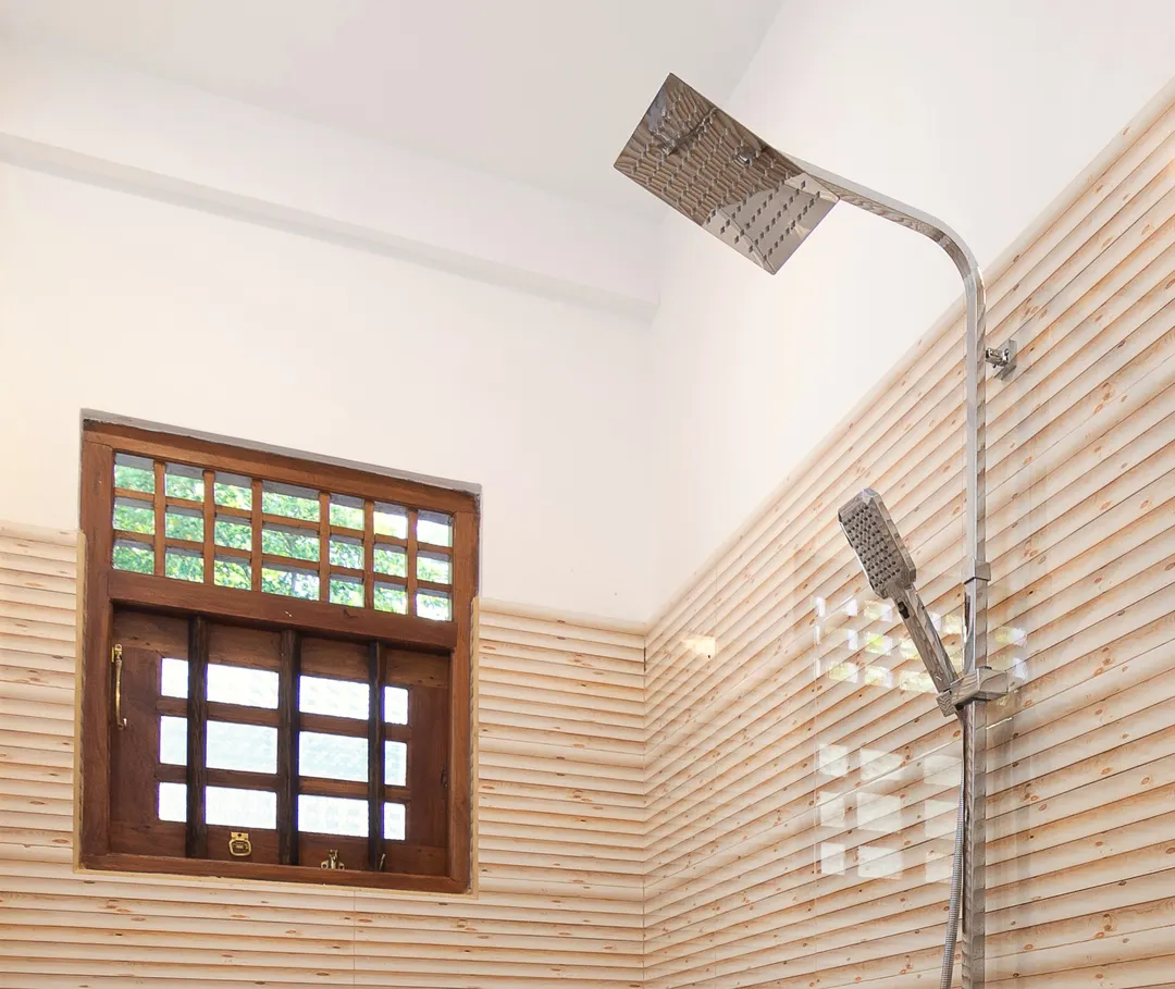 A rain shower beside a timber window