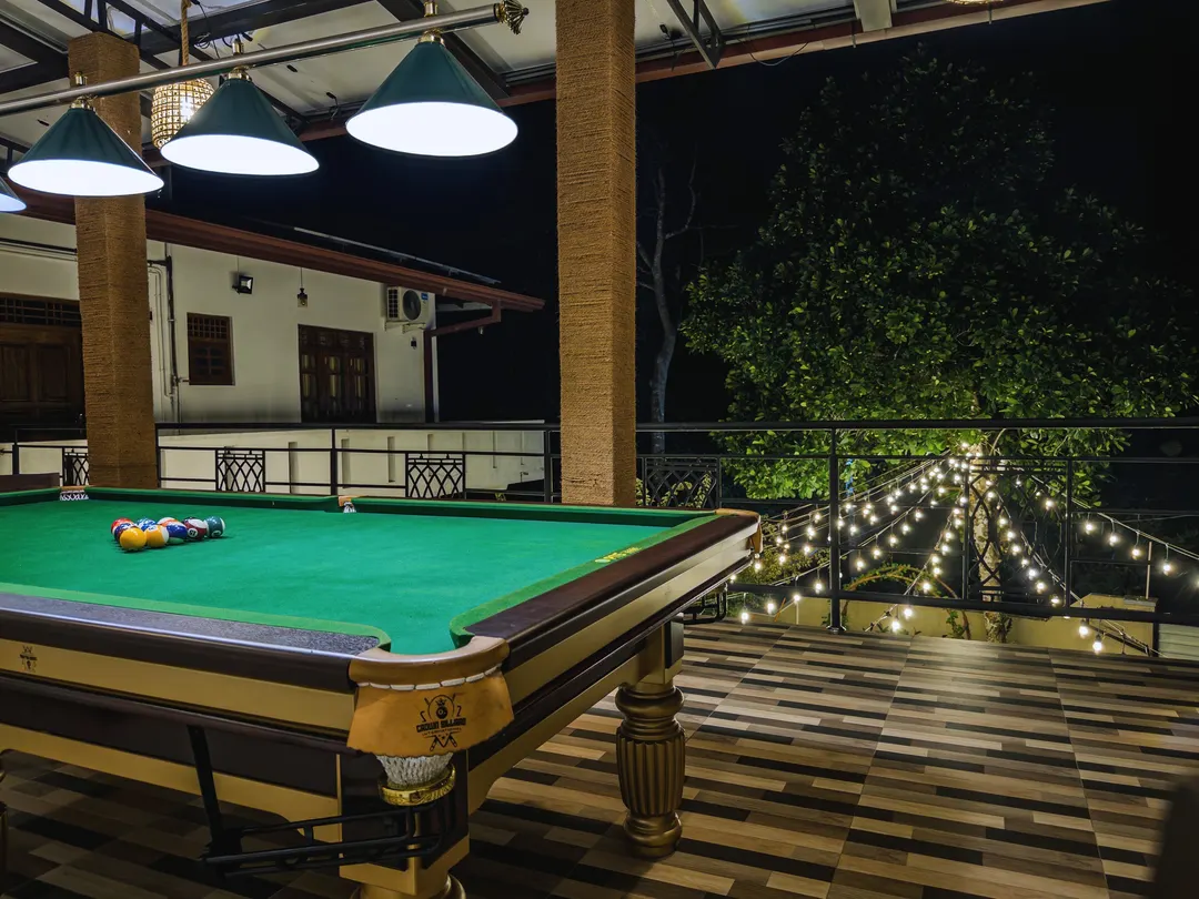 The pool table on the covered terrace at night
