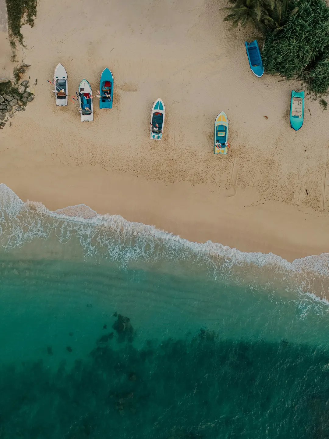 Hikkaduwa Beach from the air, fishing boats on the sand