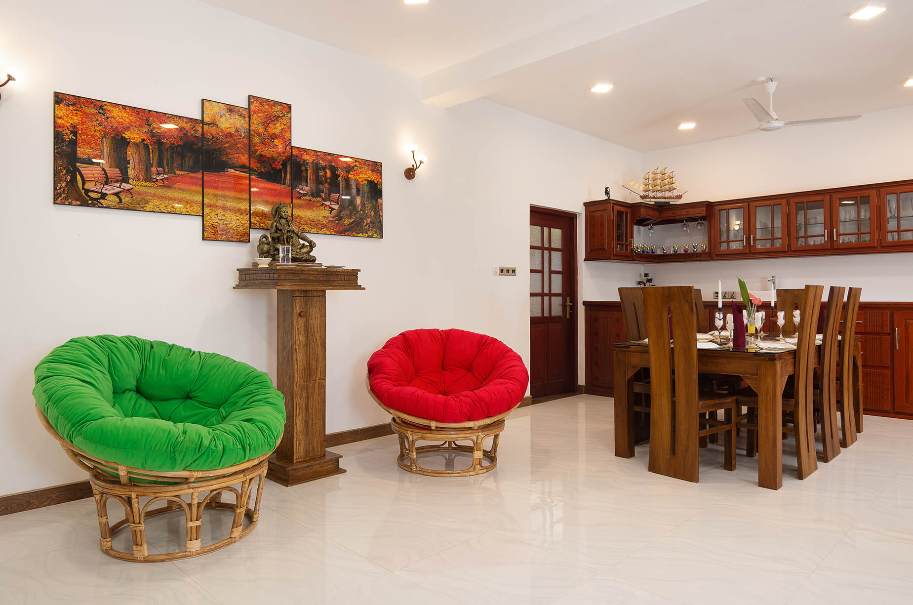 Inside Tranquil Escape villa, Hikkaduwa, a living room with a stylish dining table and chairs, perfect for gatherings.